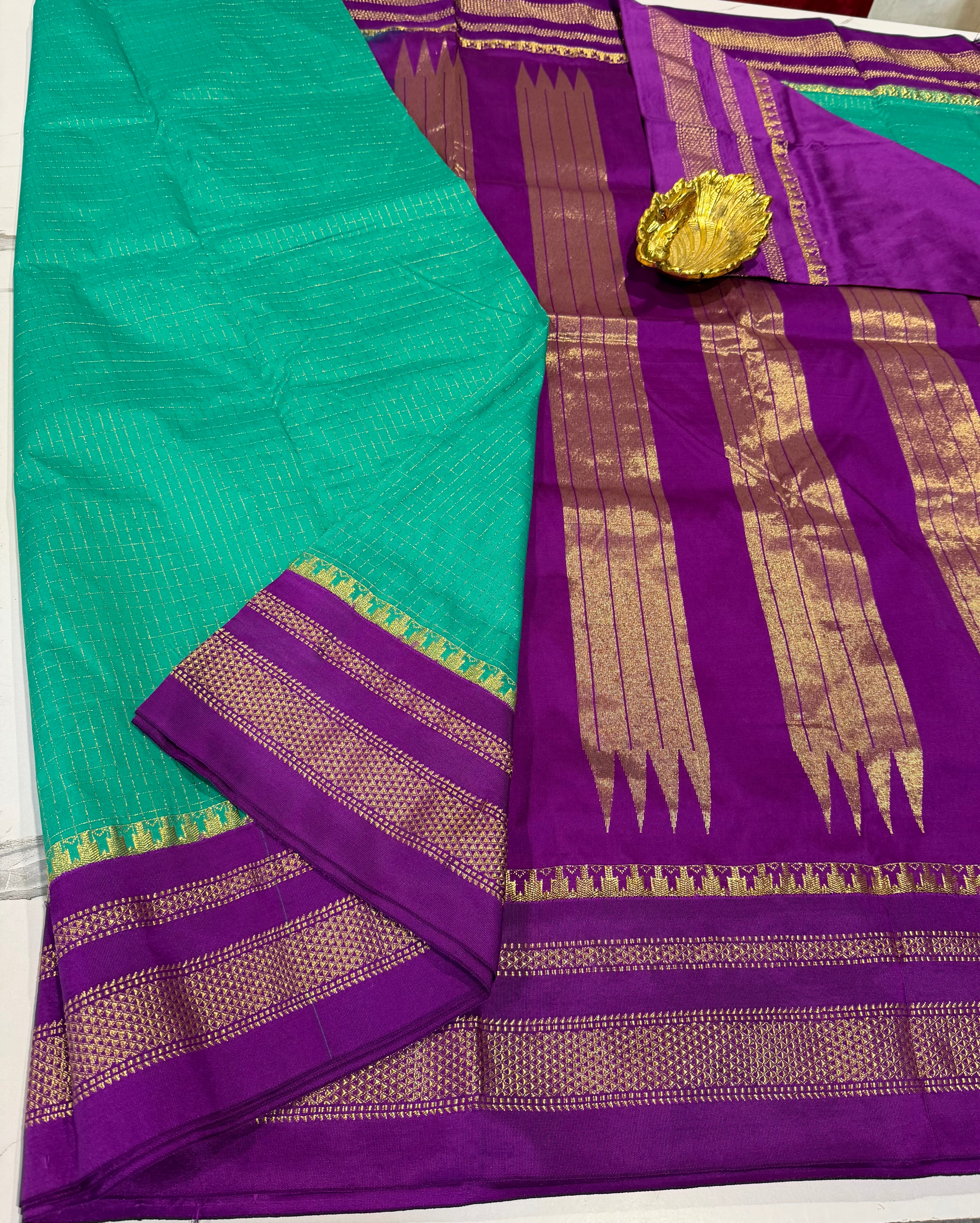 LD-NG25
 sea green and purple border saree