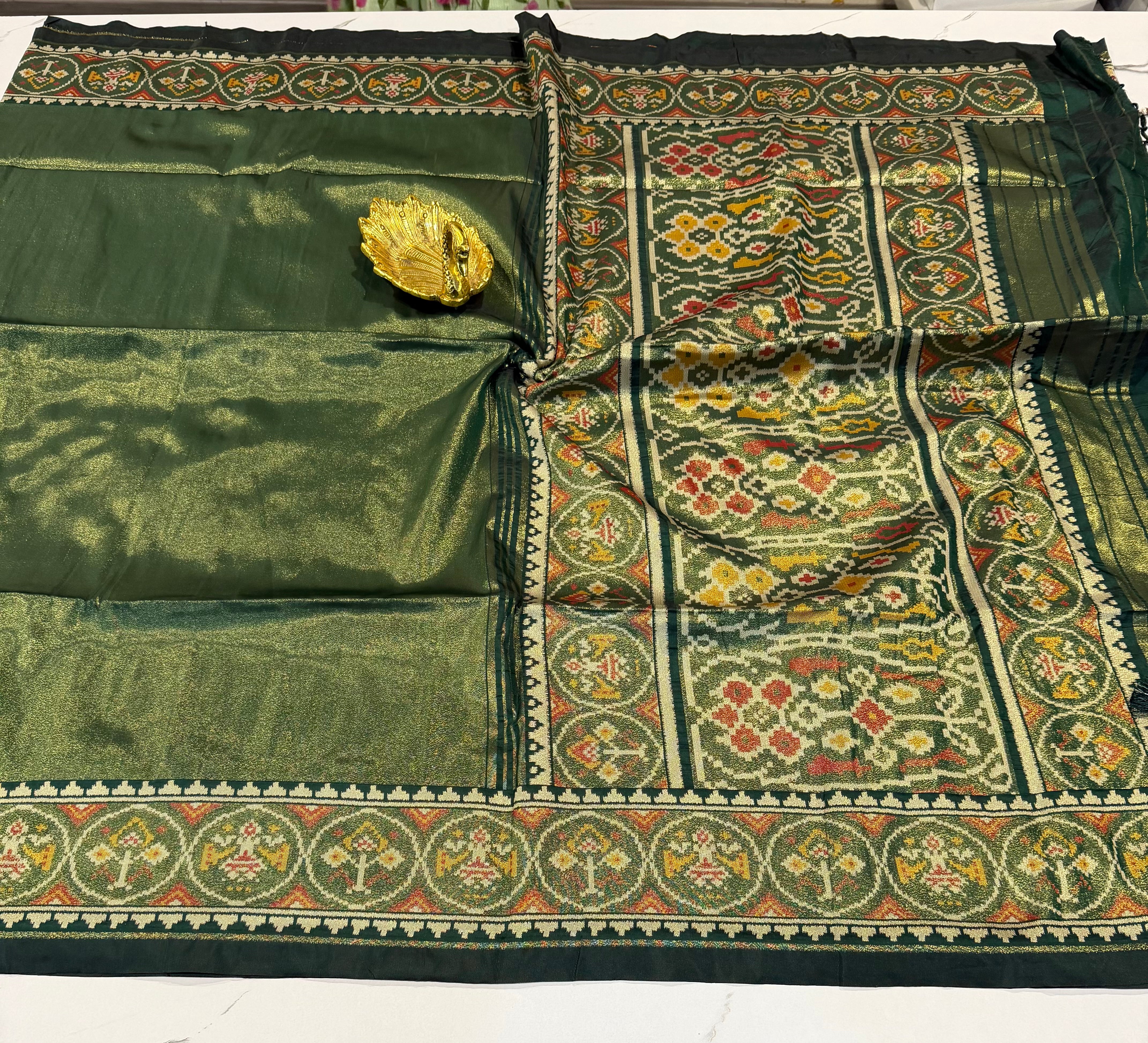 P6 tissue Patola sarees Dark green colour saree