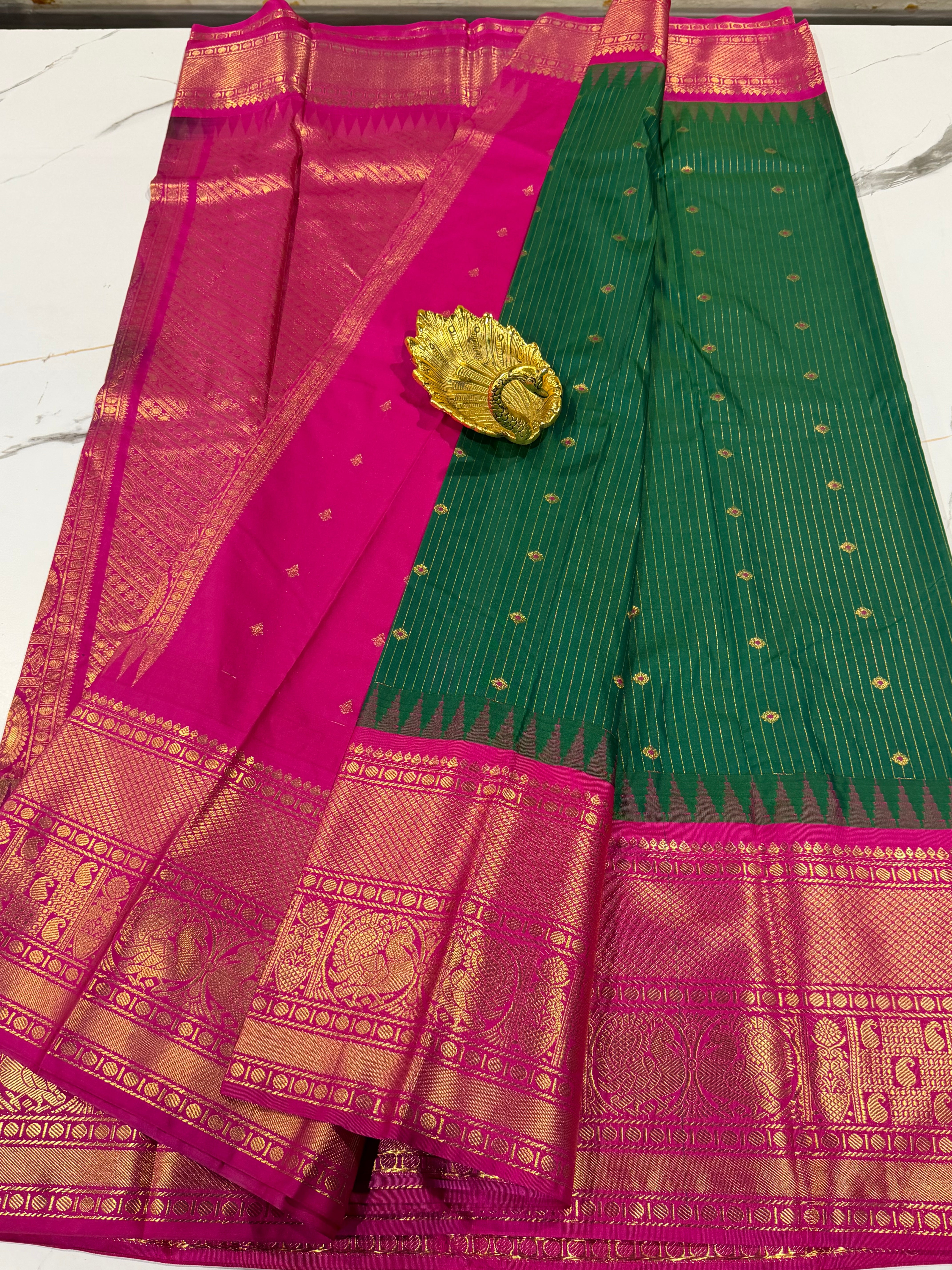 VG2 semi Gadwal green with lines and pink border saree