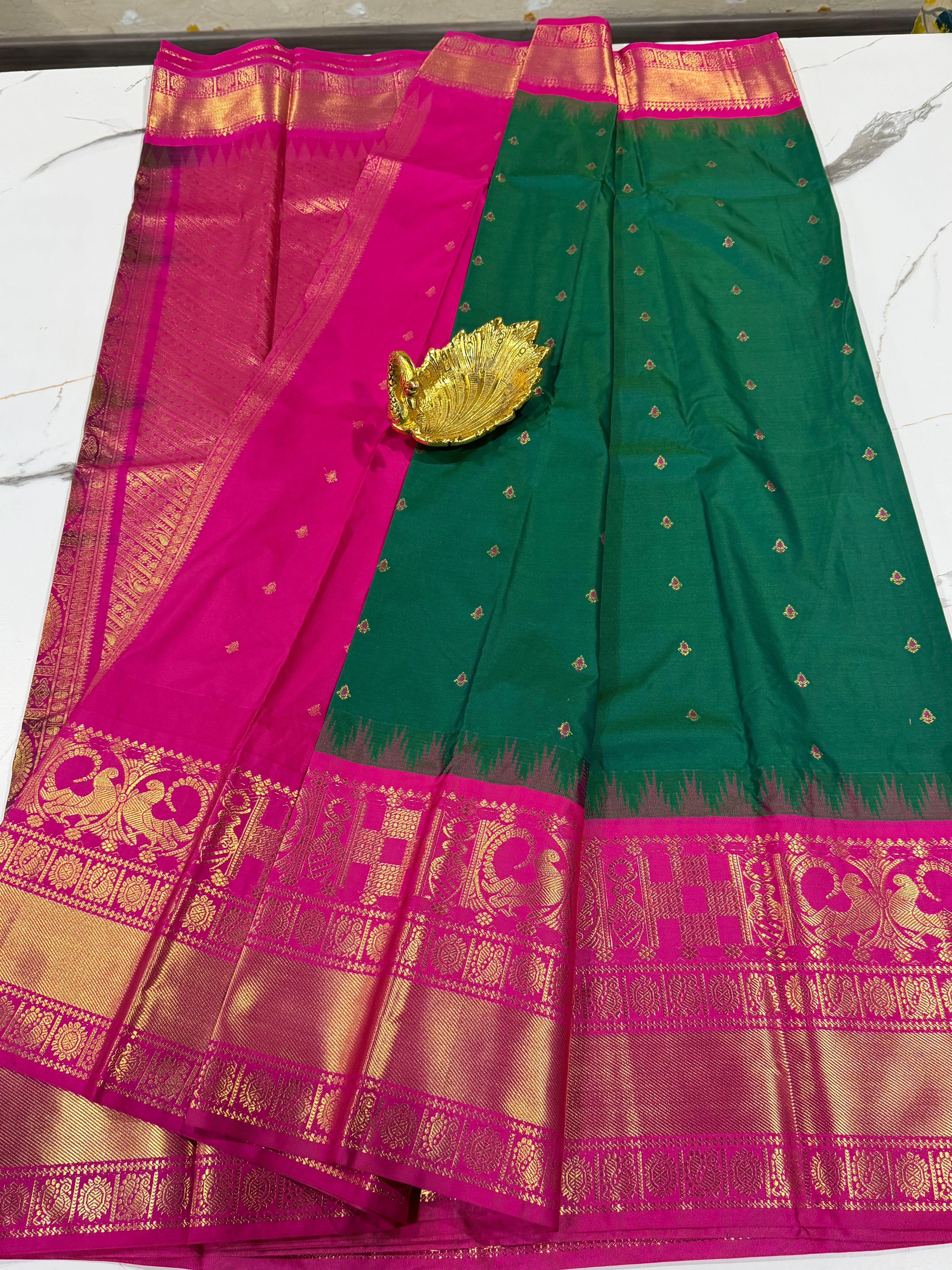 VG2 semi Gadwal green with and pink border saree