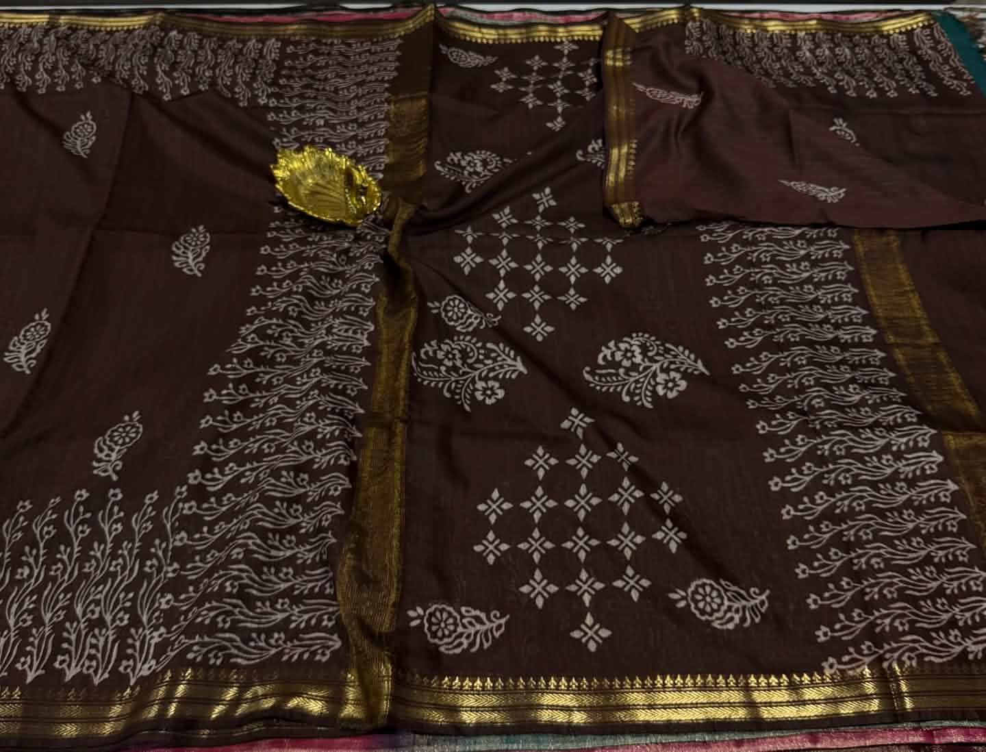 Cs2  Brown colour with gold border saree