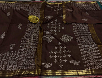 Cs2  Brown colour with gold border saree